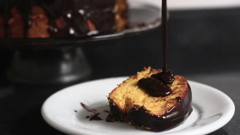 Chocolate icing on slice of carrot cake. Stock Footage 109027062