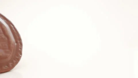 Chocolate jaffa biscuit on white background in slow motion Stock Footage 133604906