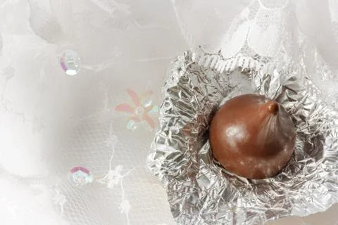 Chocolate on lace background. Stock Photos