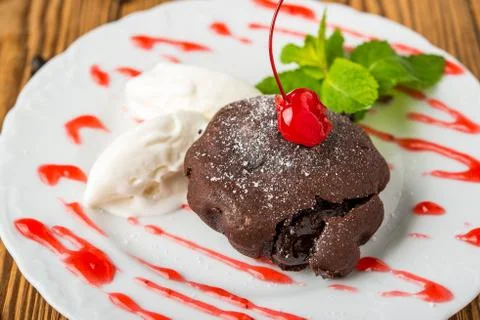 Chocolate lava cake set with ice cream and strawberry Stock Photos