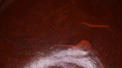 Chocolate liquid mousse pudding footage video on slow motion rotating rolling Stock Footage 117600826