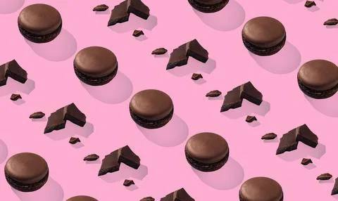 Chocolate macarons pattern with pieces of chocolate on pink background 스톡 사진