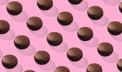 Chocolate macarons pattern on pink background isolated Stock Photos