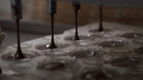 Chocolate machine - Pouring into the mold. Video stock 89499881