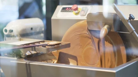 Chocolate maker is spinning chocolate. Stock Footage 107104794