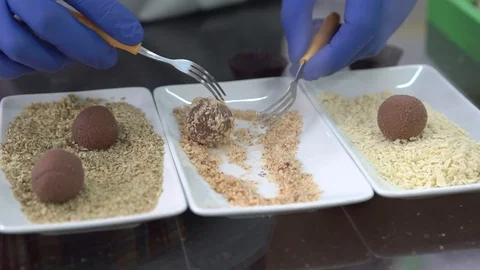 Chocolate master makes a truffle. Process of making chocolate truffles. Stock Footage 88937667
