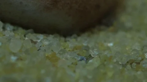 Chocolate Melts Over Sand Close-Up MAC Stock Footage 74754538