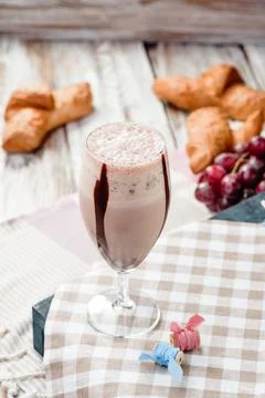Chocolate milkshake in nice French composition. Space for text Stock Photos