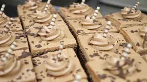 Chocolate mocha cake on platter nicely decorated camera pans over cake Stock-Footage 89364148