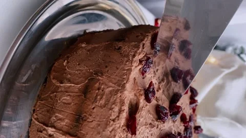 Chocolate mousse cake, close-up. Cut a piece of chocolate cake with a knife. Stock Footage 167506856