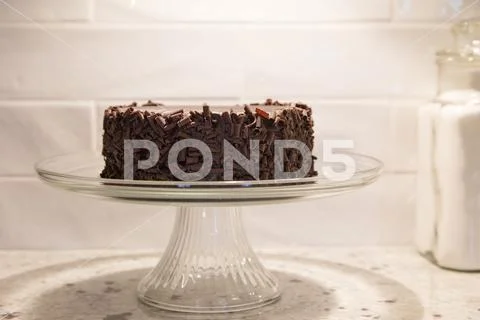 Chocolate mousse cake on footed plate Stock Photos
