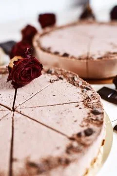 Chocolate mousse cheesecakes with a sprinkle of grated chocolate on a wooden Stock Photos