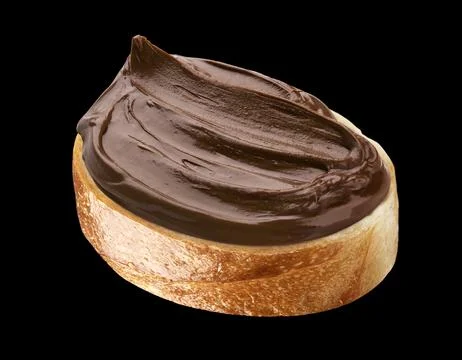 Chocolate mousse cream on bread slice isolated on black background Stock Photos