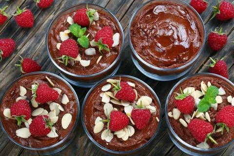 Chocolate mousse in cups on table Stock Photos