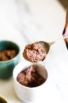 Chocolate mousse on tiny cups and marble background Stock Photos