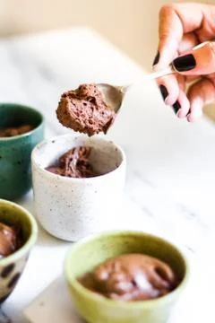 Chocolate mousse on tiny cups and marble background Stock Photos