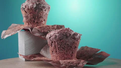 Chocolate muffin on a blue-green background Stock Footage 134704843