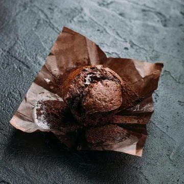 Chocolate muffin on a dark table, view from top Stock Photos