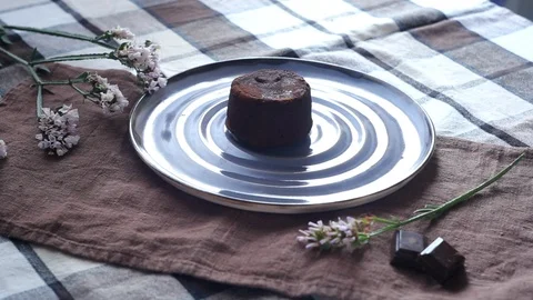 Chocolate muffin in a plate on the table. Stock Footage 115213243