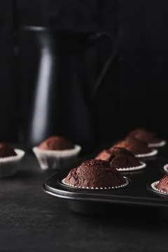 Chocolate muffins in bakeware Stock Photos