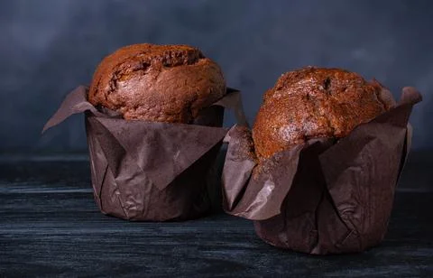 Chocolate muffins on a dark background Stock Photos