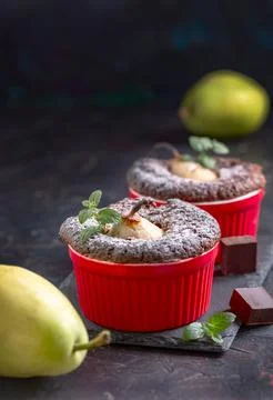 Chocolate muffins with pears. Stock Photos