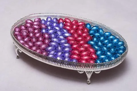 Chocolate multi-colored candy Easter eggs in a dish, Stock Photos