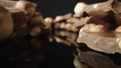 Chocolate with nuts in pieces Stock Footage 145549425