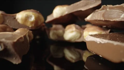 Chocolate with nuts in pieces Stock Footage 145549577