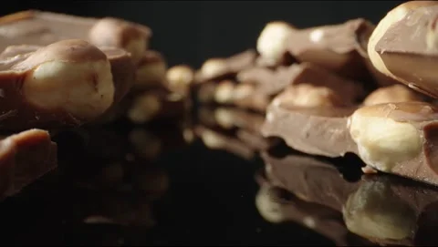 Chocolate with nuts in pieces Video stock 145549739