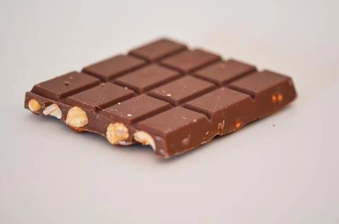 Chocolate with nuts on a withe background Stock Photos