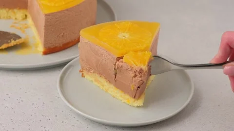 Chocolate-orange mousse cake with biscuit base, jelly and orange circles. Stock Footage 279566005