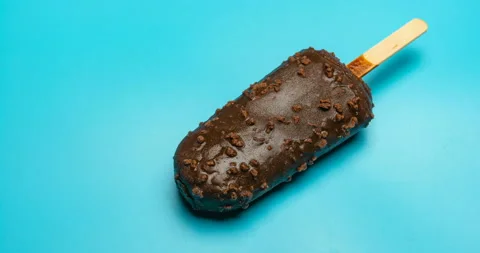 Chocolate outer popsicle with beans melting time lapse and reverse Stock Footage 96188821