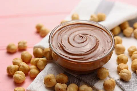Chocolate paste with a bowl on a table. Stock Photos