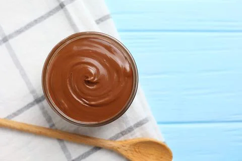 Chocolate paste with a bowl on a table. Stock Photos