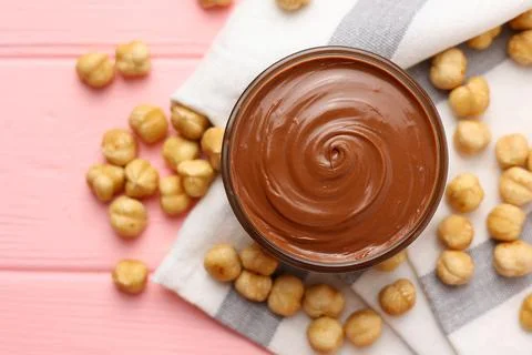 Chocolate paste with a bowl on a table. Stock Photos