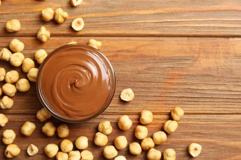 Chocolate paste with a bowl on a table. Stock Photos