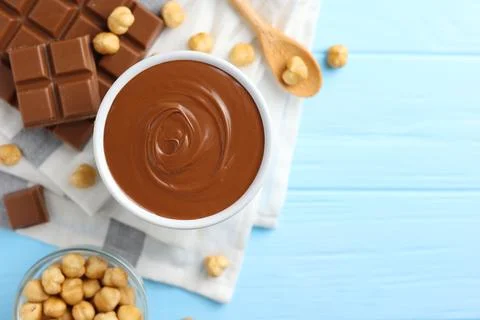 Chocolate paste with a bowl on a table. Stock Photos