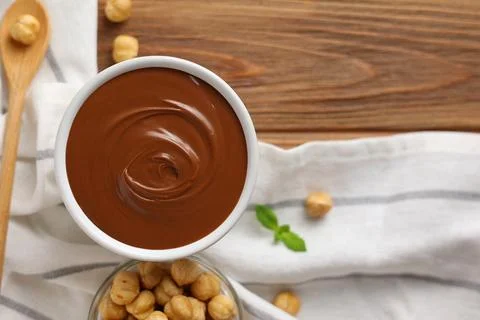 Chocolate paste with a bowl on a table. Stock Photos