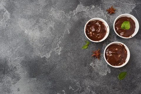Chocolate paste with mint, cinnamon and anise on dark background with copy .. Foto stock
