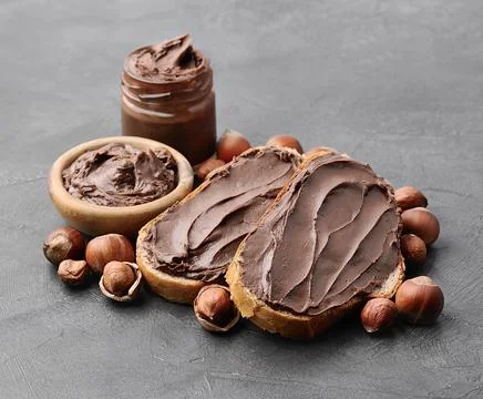 Chocolate paste with nuts Stock Photos