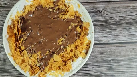 Chocolate paste sauce on top of Sweet Koshary recipe Stock Footage 273157148
