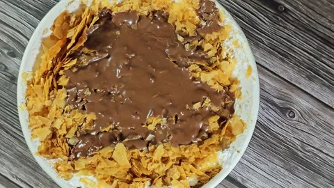Chocolate paste sauce on top of Sweet Koshary recipe Stock Footage 273157245