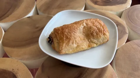 Chocolate pastry rotating on turntable Stock Footage 333597111