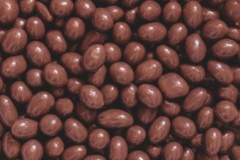 Chocolate peanuts Easter eggs texture close-up Stock Photos