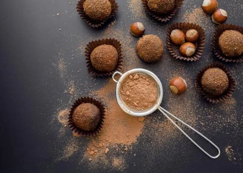 Chocolate petit four with hazelnuts Stock Photos
