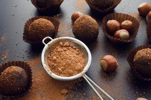 Chocolate petit four with hazelnuts Stock Photos