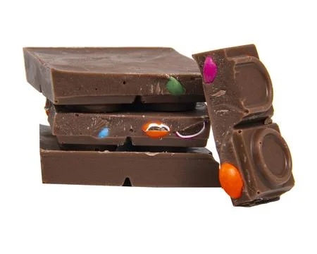Chocolate pieces snack stack isolated on the white background Stock Photos