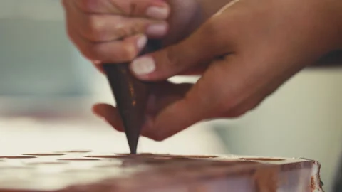 Chocolate piped into a mold Stock Footage 274631142