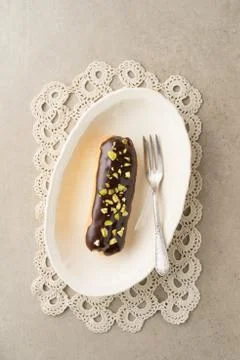 Chocolate pistachio eclair Stock Photos